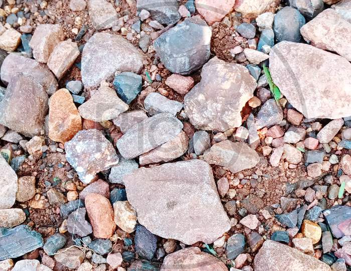 Colour stones with red soil in India