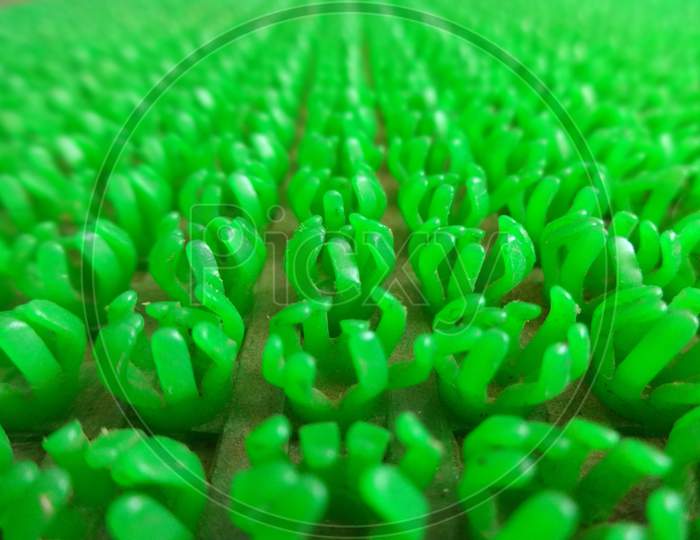 Green plastic spoke closeup macro photography