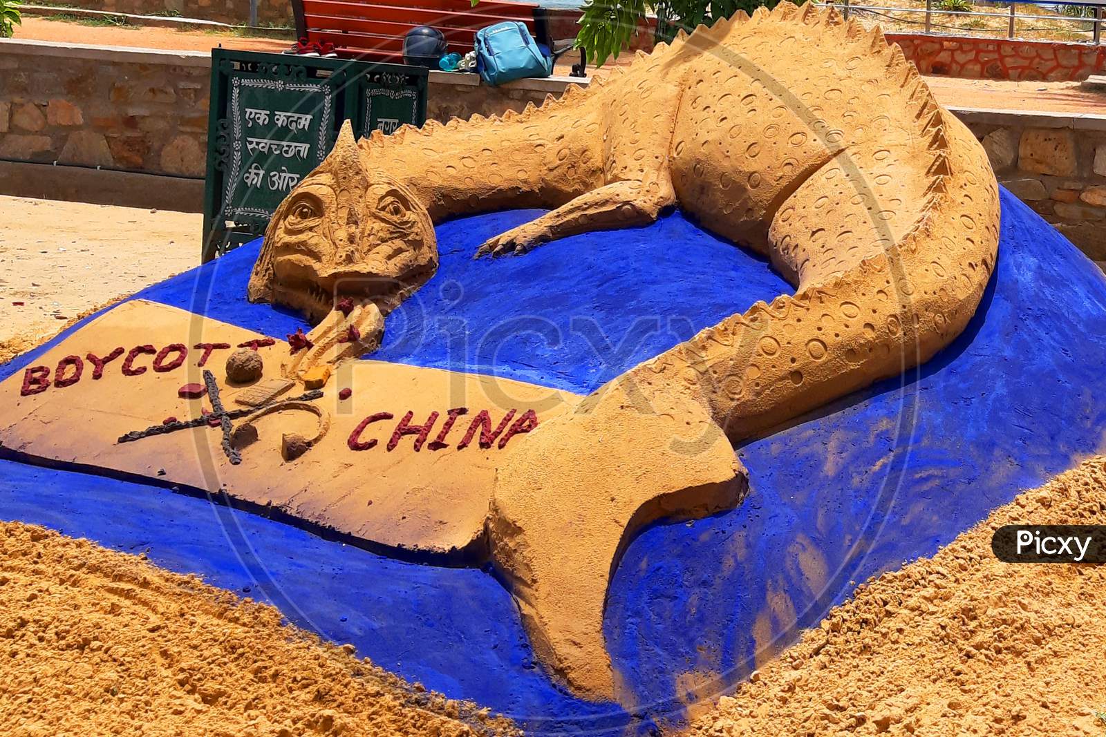 Sand artist Ajay Rawat creates a sculpture to support the "Boycott China Product" movement in Ajmer, India on July 03, 2020