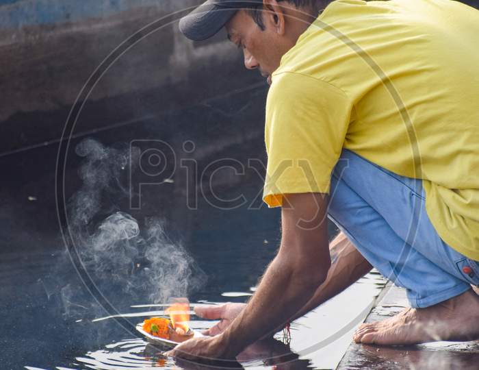 New Delhi, India - March 04, 2020: A man sitting with Indian traditions during morning time at Yamuna river ghat in New Deli, India, Yamuna Ghat View