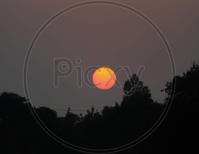 Sunset With Big Round Red Sun