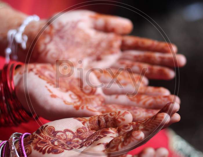 Henna mehndi tattoo art on girl's hands