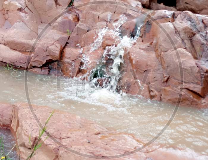 Water flowing through the red rocks