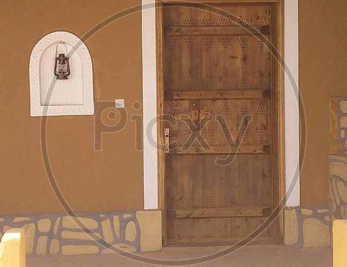 Ancient wood door and old light  saudi arabian traditional architecture