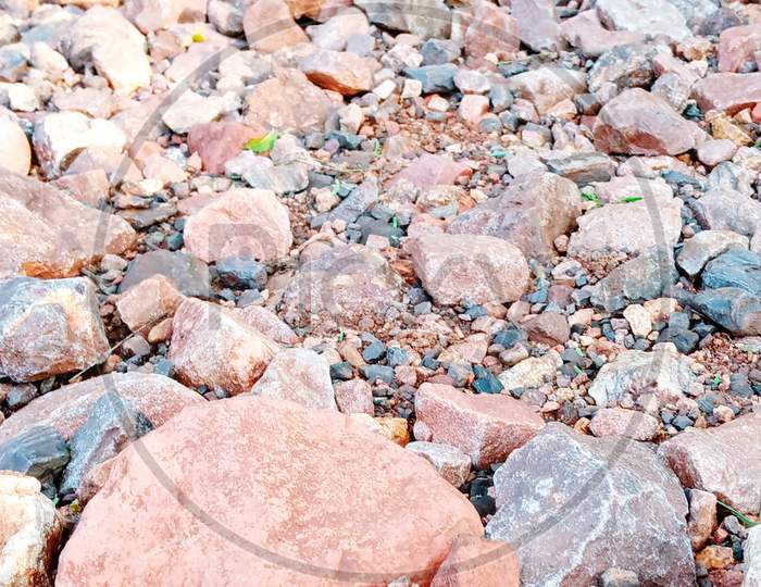 Colourful stones in red soil
