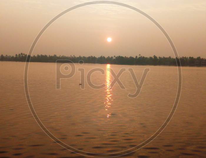 view of sunset in the backwaters of kerala