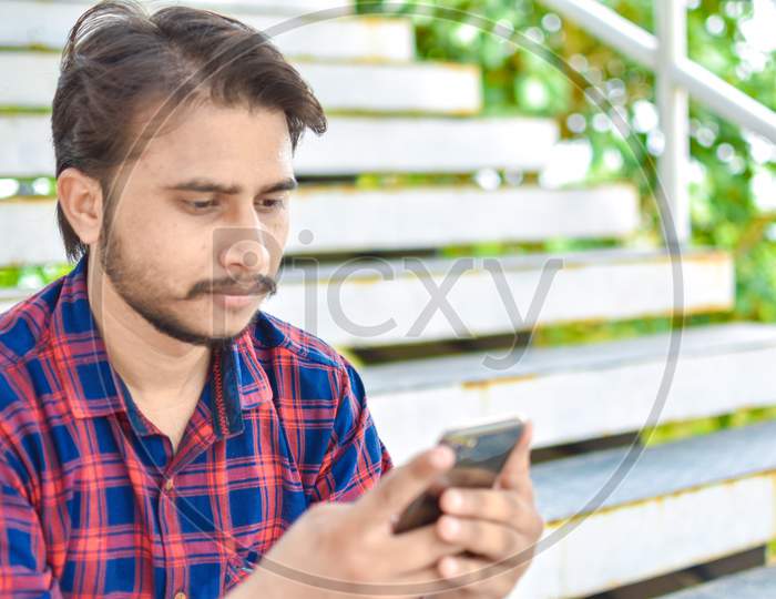 indian college student playing phone