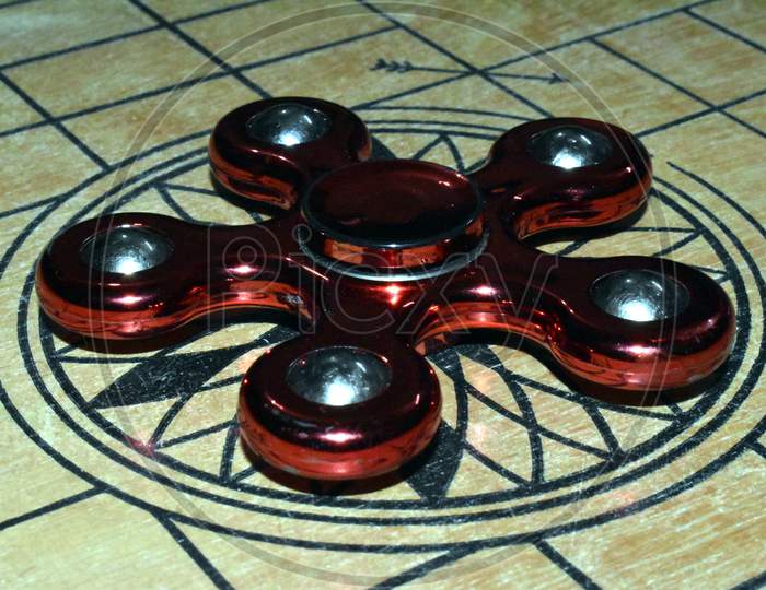 Beautiful Picture Of Spinner And Wooden Carom Board