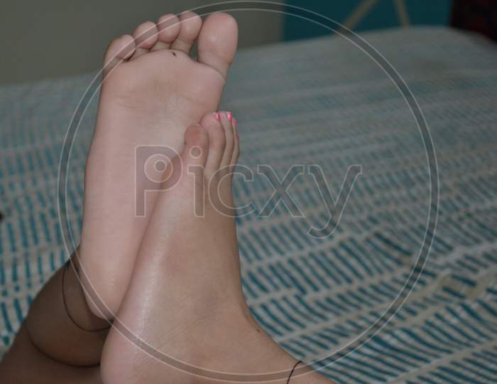 cute and beautiful little girl foot photo