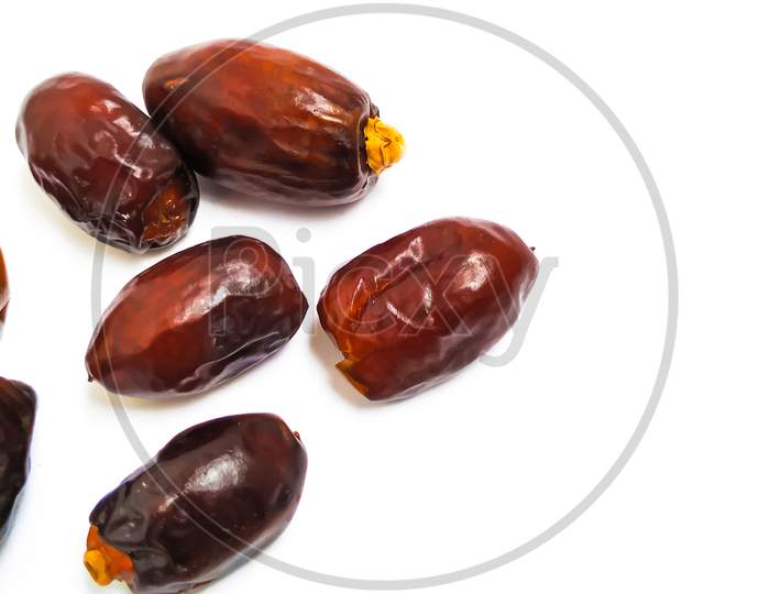 Group of Raw dry Dates Brown Color Fruit isolated on white Background
