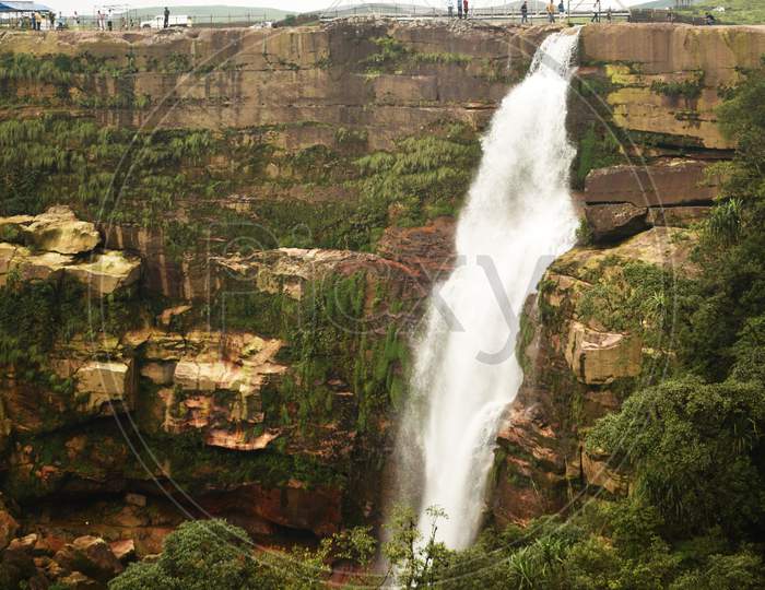 Dainthlen Falls And A Large Green Valley On The Mountain of Sohra or Cherrapunji In Meghalaya In India