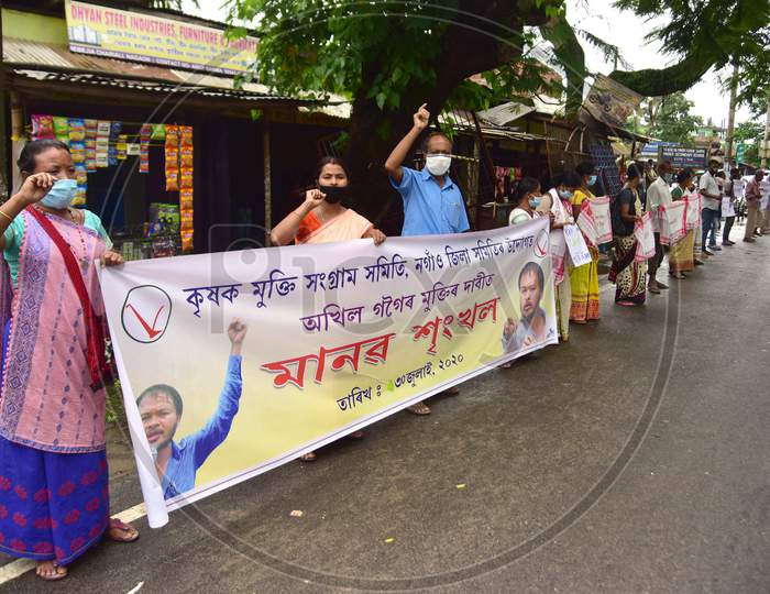 Krishak Mukti Sangram Samiti (Kmss) Activists Form A Human Chain During A Protest Against CAA 2019 And Demanding Release Of Their Leader Akhil Gogoi At Babejia In Nagaon District Of Assam On July 30,2020.