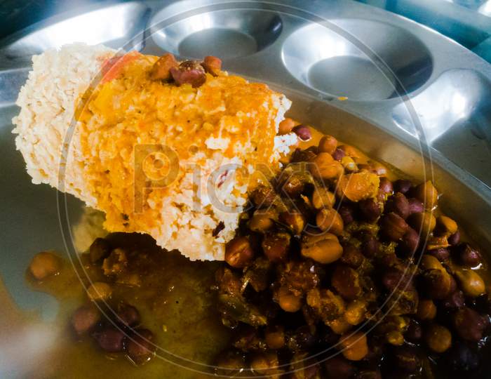 Kerala Traditional Food Puttu And Kadala Curry In A Steel Plate.