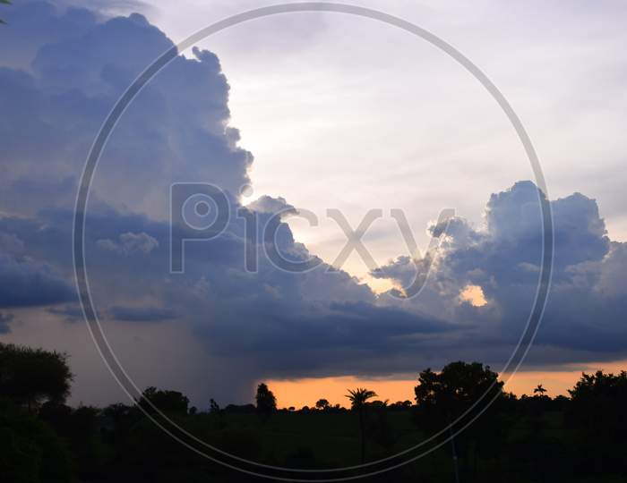 Sun Rise And Sun Set Background, Yellow, Black And Orange Clouds