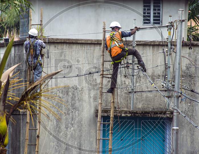 The electricians on their job.