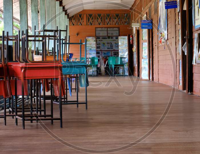 Thai School Corridor Of Wooden Building During Recess Period, The Signs Tell The Name Of Classroom'S Primary Grade