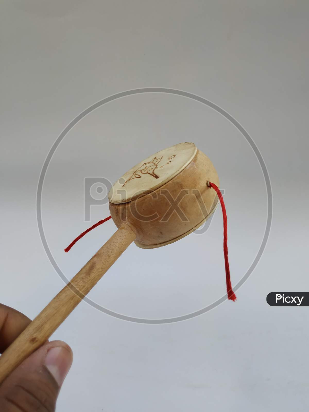 Kids Muscial Toys Mucca Sacra Wooden Rattle Toy Damru isolated on white background
