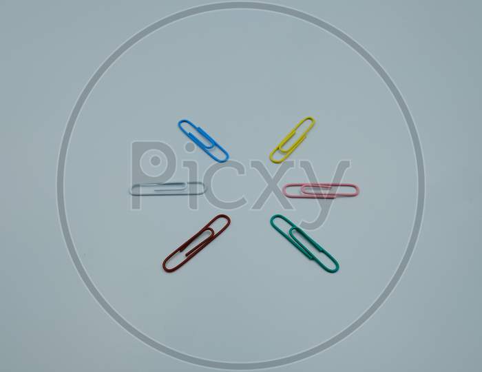 Asterisk Shape By Paper Clips Multicolor On White Background