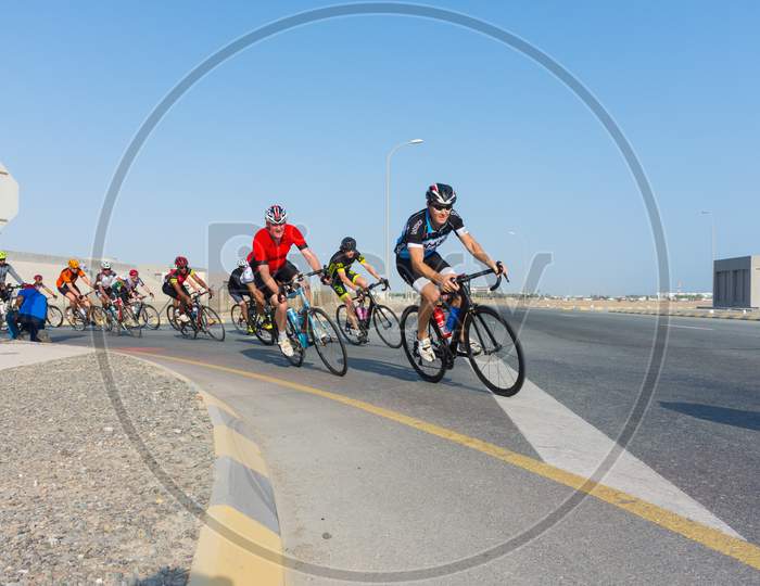 Muscat, Oman 15Th September 2017. Group Of Bike Racers Riding On The Road Track.