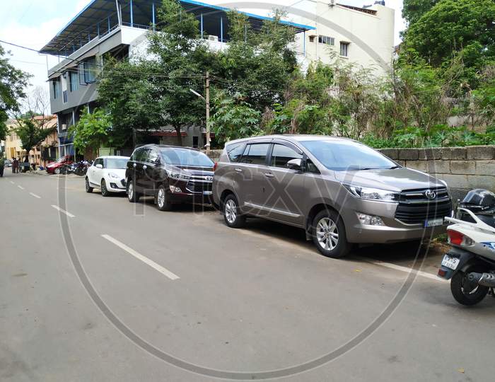 Closeup Of New Gray And Black Color Tata Altroz Car Parking On Asphalt Road