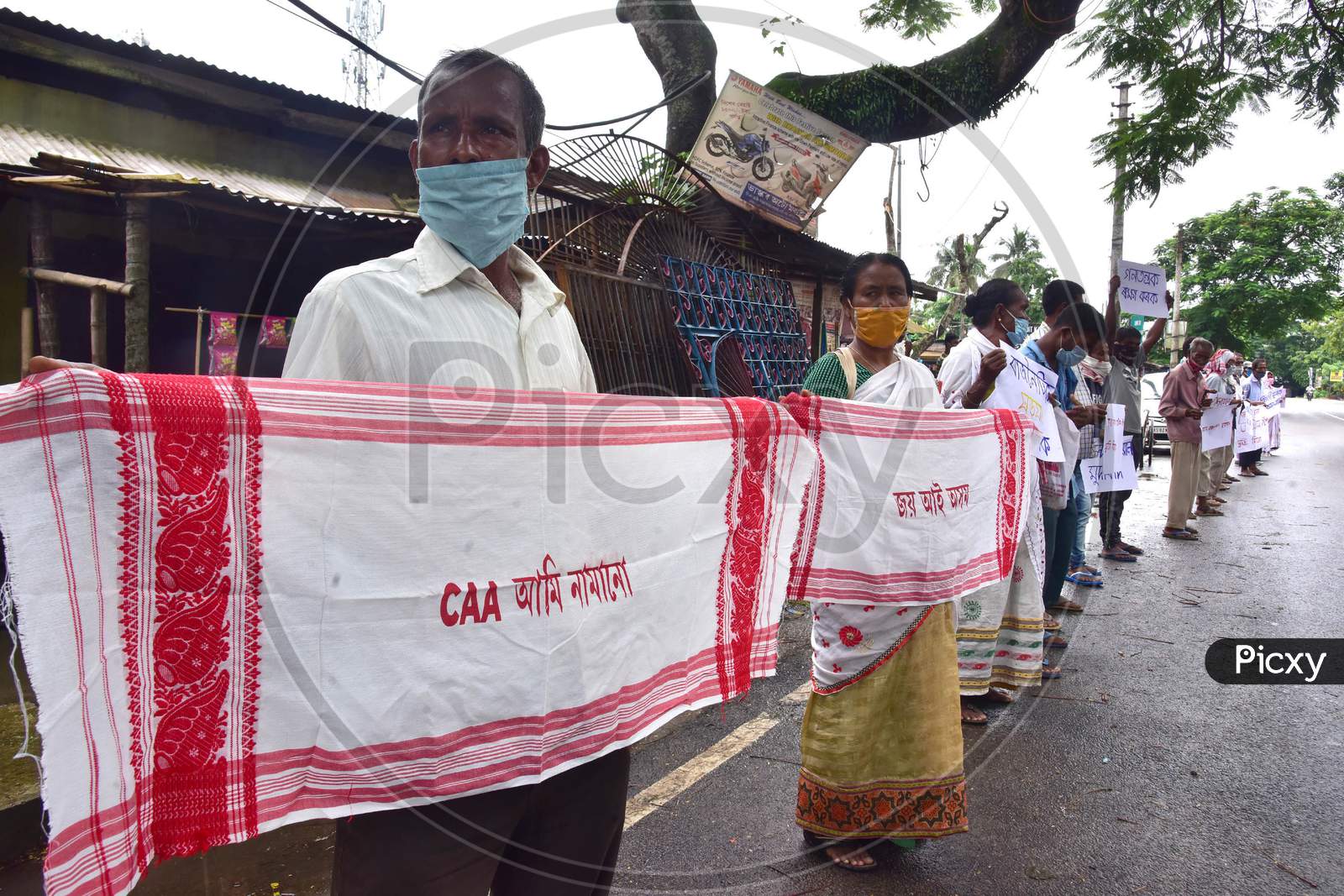 Nagaon : Krishak Mukti Sangram Samiti (Kmss) Activists Form A Human Chain  During A Protest Against Caa 2019 And Demanding Release Of Their Leader Akhil Gogoi At Babejia In Nagaon District Of Assam On July 30,2020.