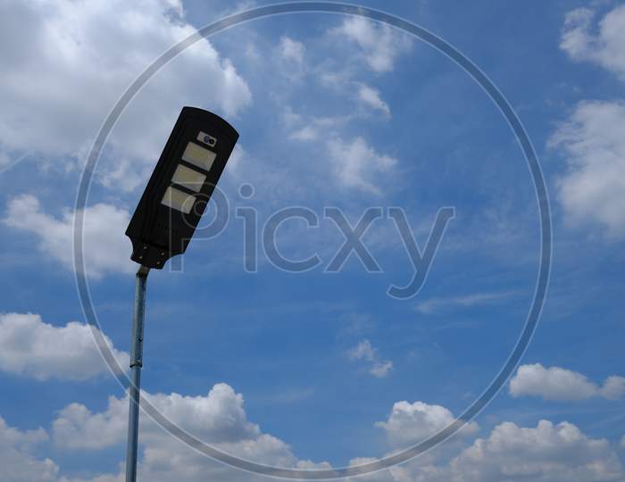Close Up Isolated Led Lamppost With Bright Cloudy Sky