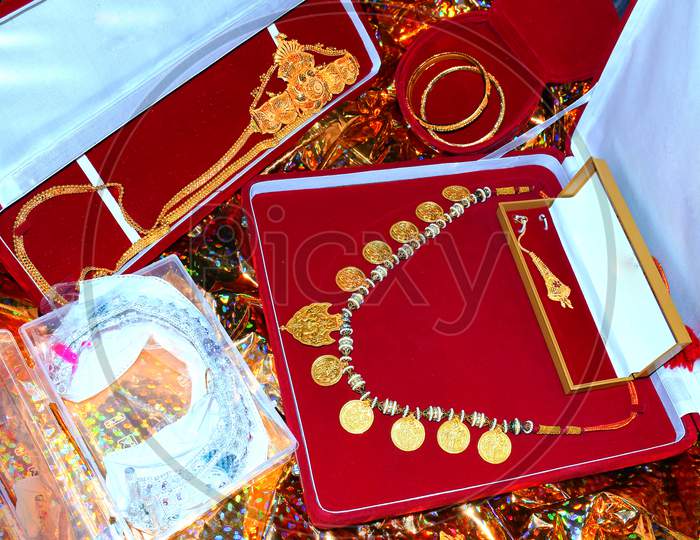 Gold And Silver Jewelery In Color Gift Box