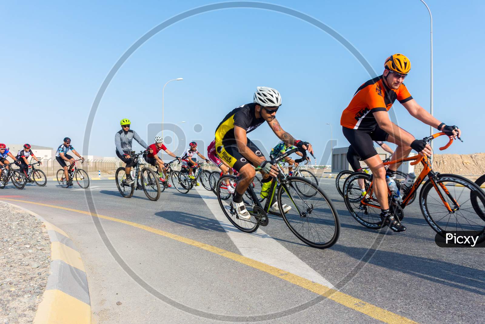 Muscat,Oman 15Th September 2017. Bicycle Racers Riding On The Road Racing Track To Win The Race.