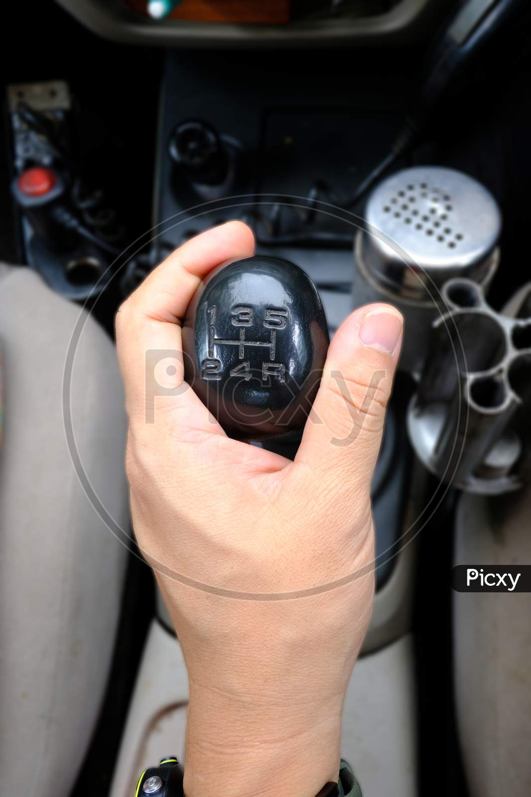 Hand Holding Gear Stick Or Gear Shifter In A Car Selective Focus