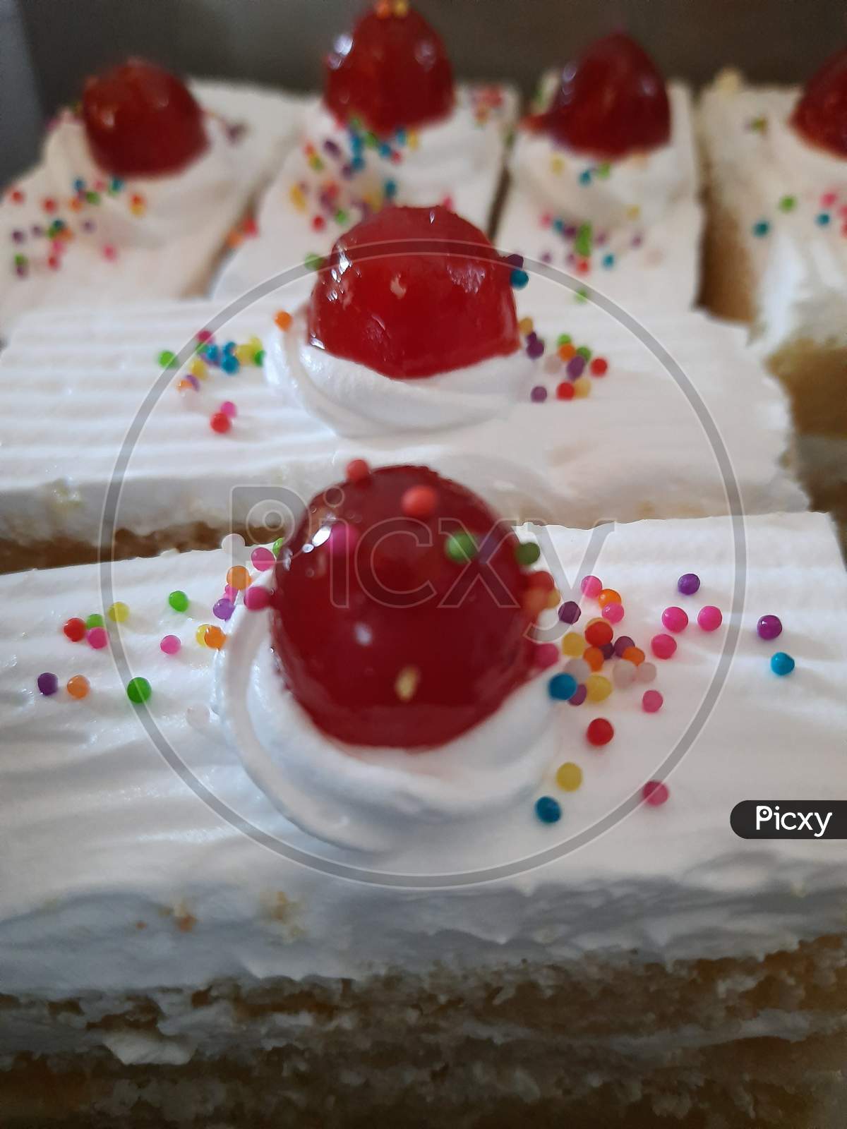 Delicious cream cake with cherries