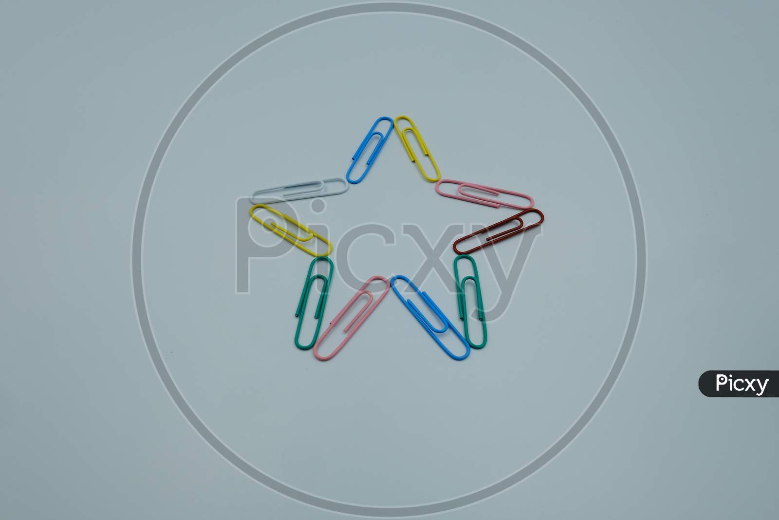 Star Shape By Paper Clips Multicolor On White Background