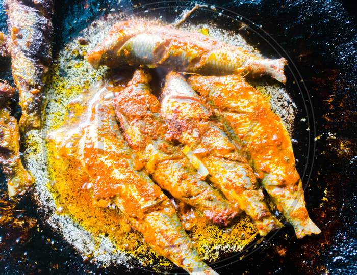 A Top Angle Shot Of Sardine Fish Fried In A Frying Pan In Kerala Style.