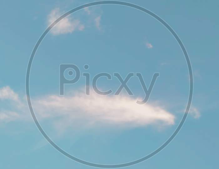 Aeroplane cloud in the blue sky