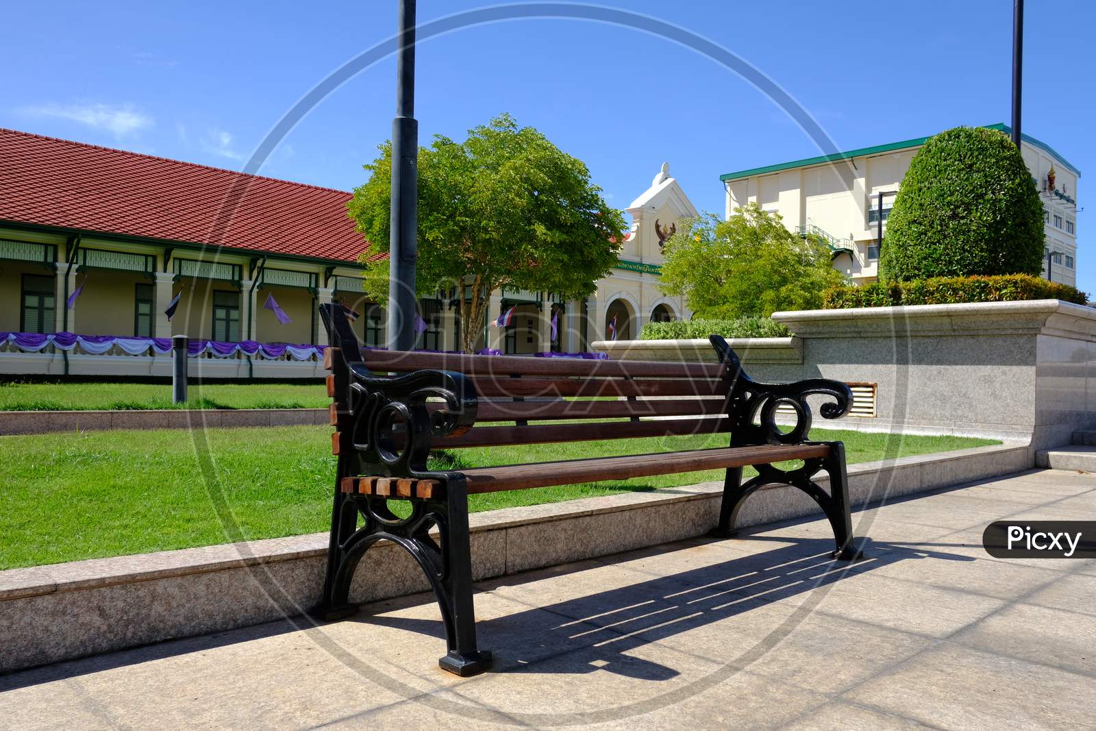 Wooden And Forged Benches In The Park