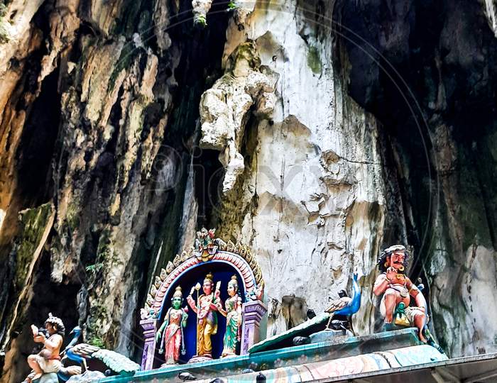 Beautiful Natural Limestone Cave In Malaysia. Entrance To Dark Cave From A Huge Hollow Feature. One Of Main Caves Located In Batu Caves Hill. Kuala Lumpur Malaysia