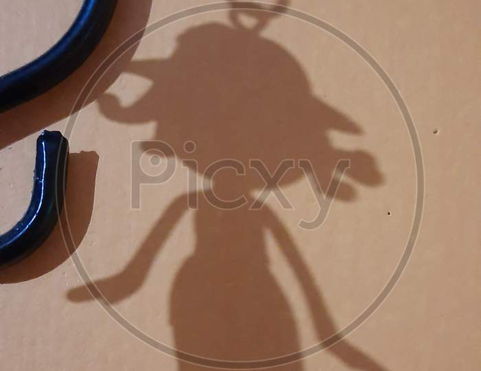 Shadow of small girl doll