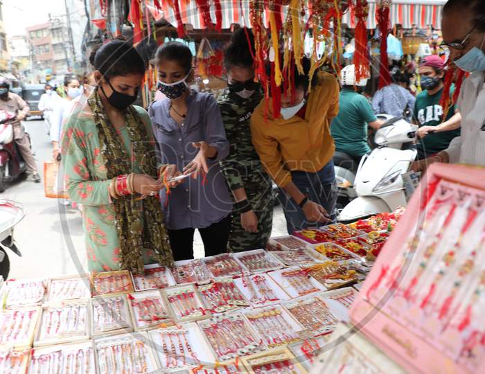 Women buy rakhi ahead of Raksha Bandhan festival, in Jammu on July 31, 2020