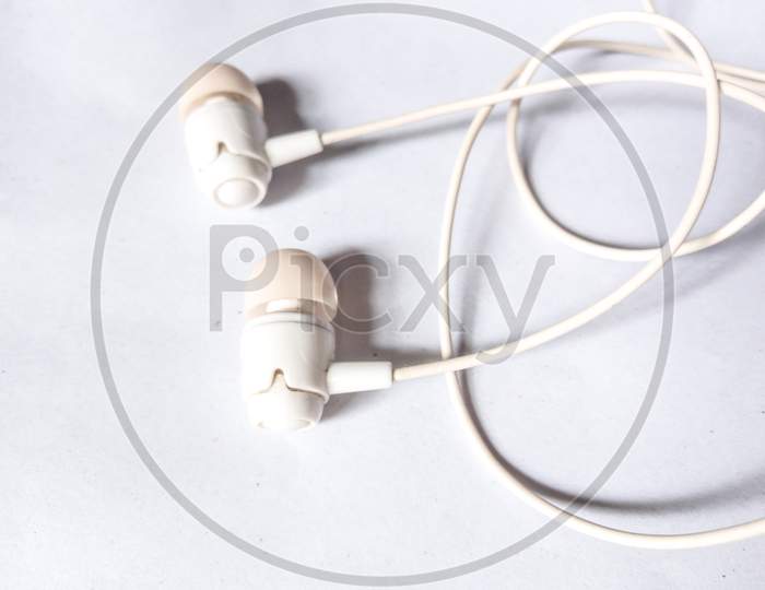 White earphone on white background