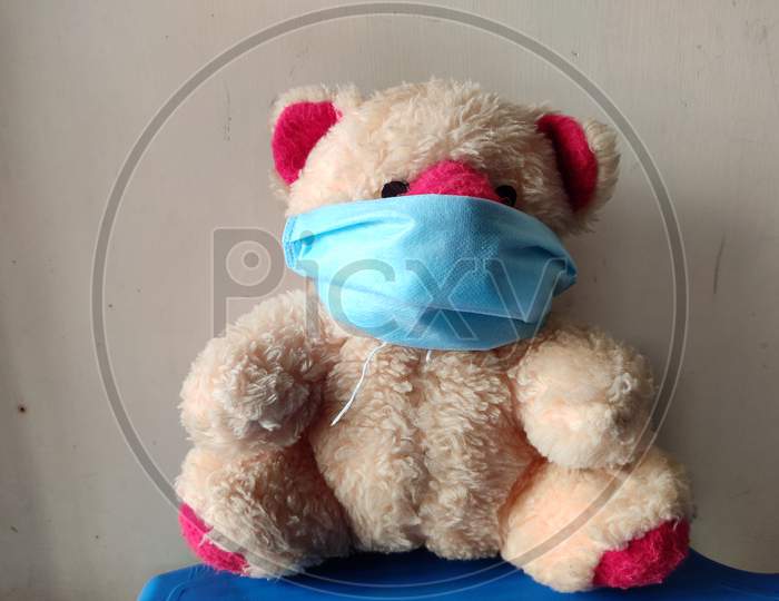 A Teddy bear in a medical mask, concept of COVID-19