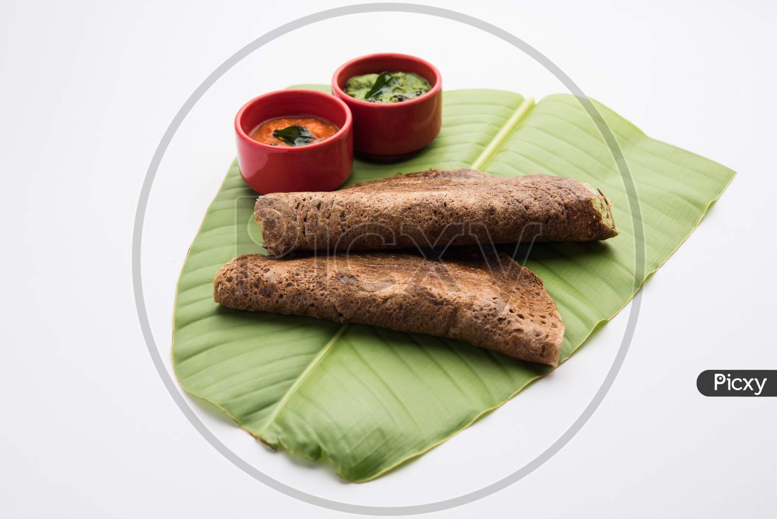 Ragi Dosa Made Using Batter Of Finger Millet Is A Healthy Indian Breakfast Served With Chutney