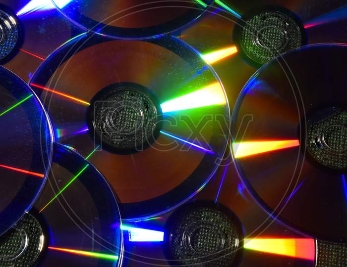Vintage Cd Or Dvd Disk Background, Old Circle Discs Used For Data Storage, Share Movies And Music, Colorful Background.