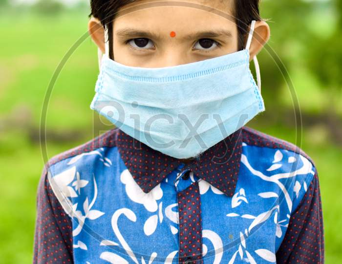 indian cute girl wearing blue mask