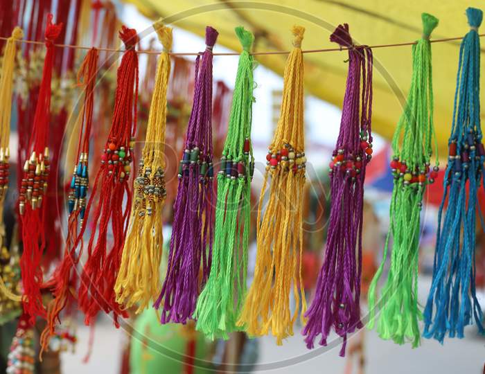 Rakhis are on display ahead of the Raksha Bandhan festival at road side shops in Prayagraj, July 31, 2020.