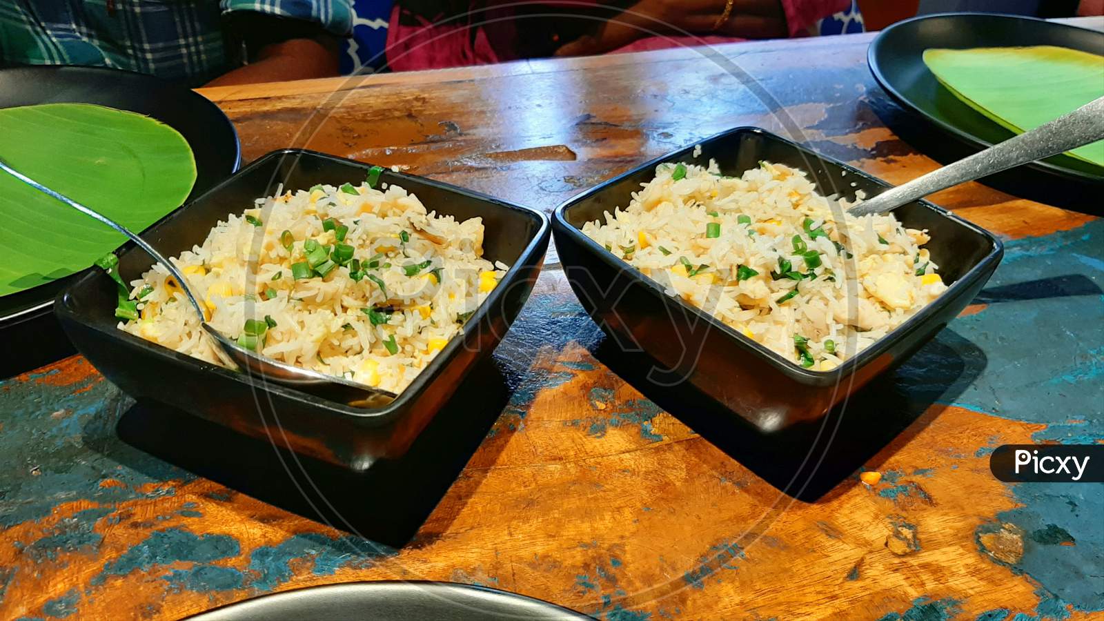 Chicken fried rice in wooden background
