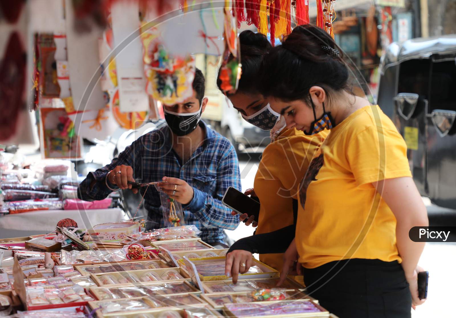 Women buy rakhi ahead of Raksha Bandhan festival, in Jammu on July 31, 2020