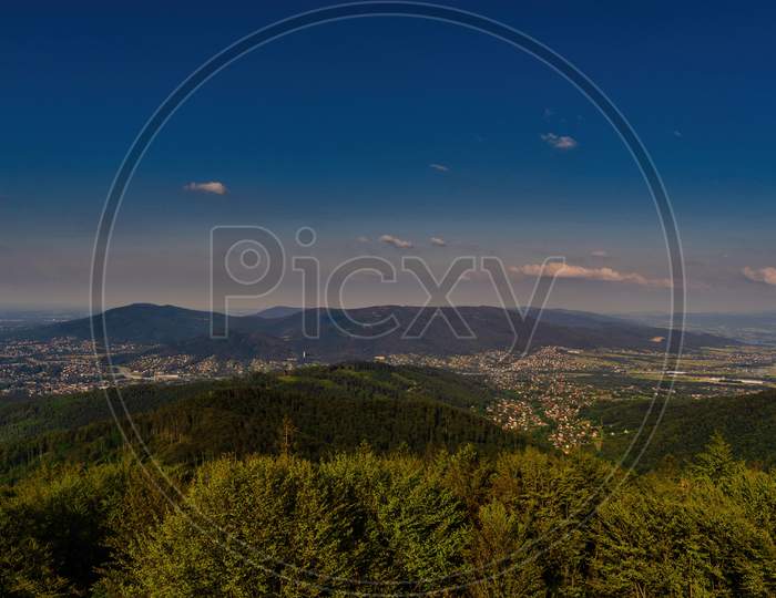 Bielsko Biala, South Poland: Wide Angle From Up Above Panoramic Detailed High Definition View Of Scenic Mountains, Green Forest And City Against Blue Sky
