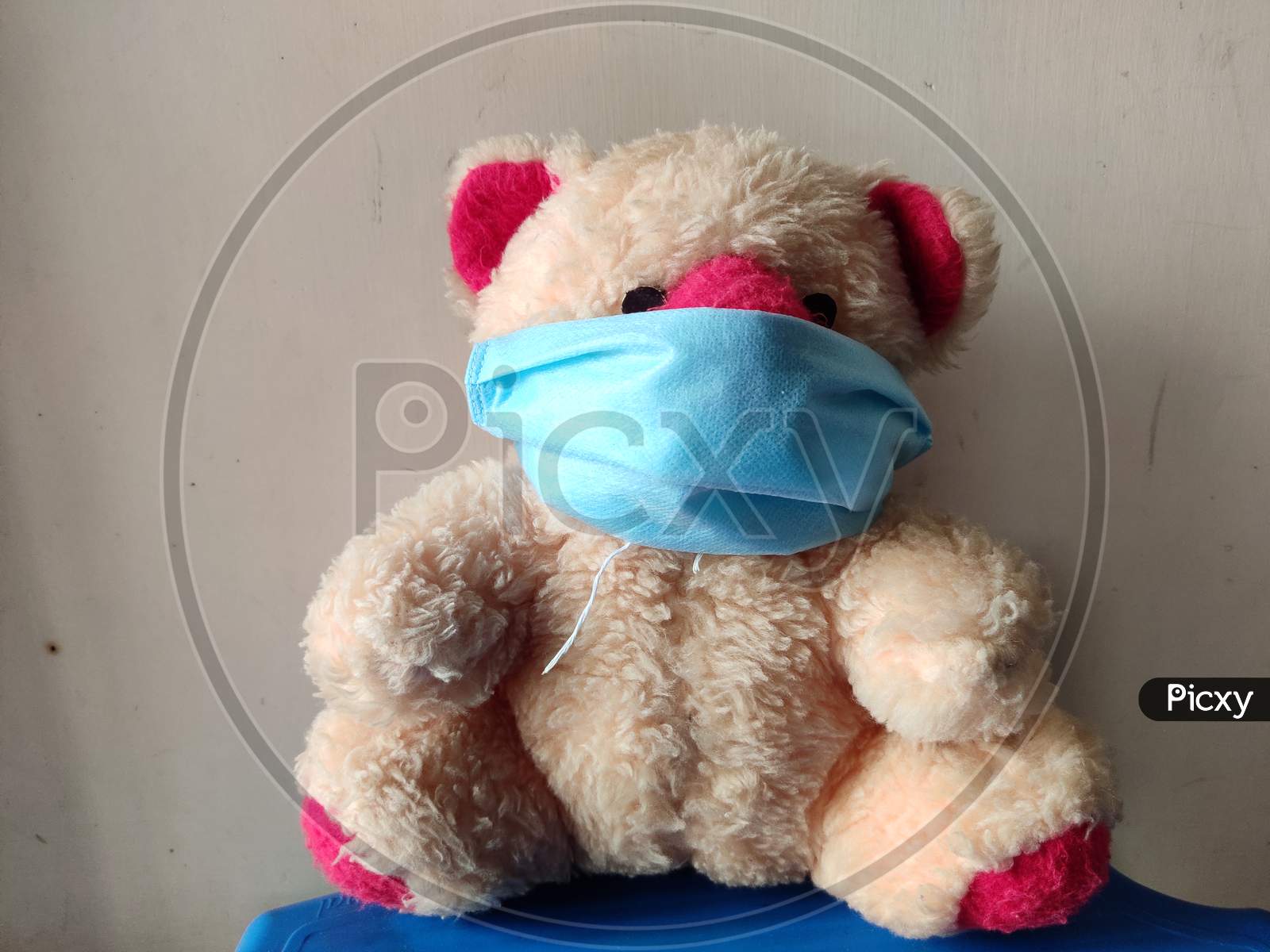 A Teddy bear in a medical mask, concept of COVID-19