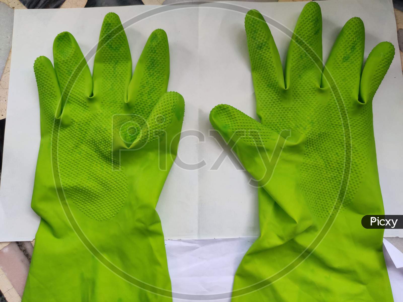 Gloves for protect hand against COVID-19 on blue background