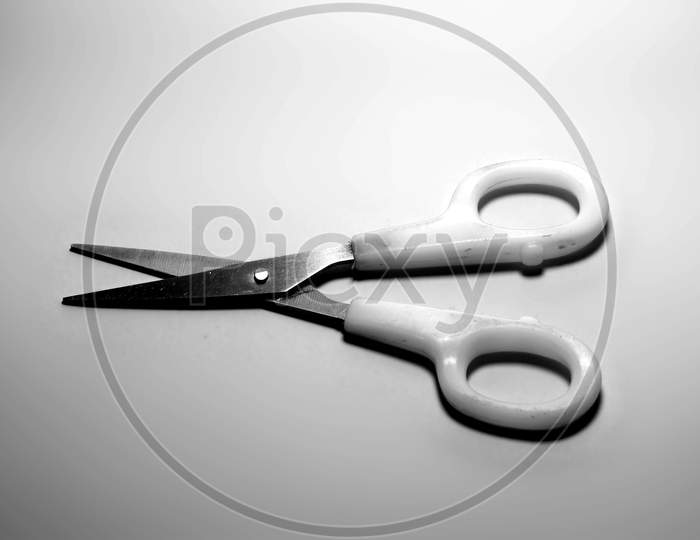 Black And White Scissors Hand-Operated Cutting Instruments. Scissors For Cutting Paper And Thin Materials On White Background