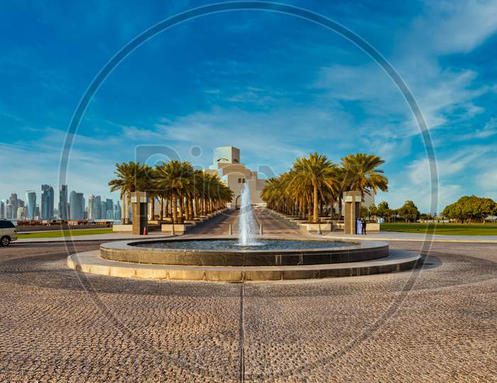 Doha cor niche  daylight view with museum of Islamic art and Doha skyline in background and fountain in foreground